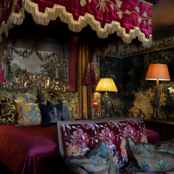 Gothic-style luxury hotel suite with four-poster bed