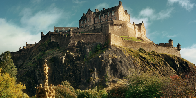 Edinburgh Castle perched on the hill on a summers day with blue sky