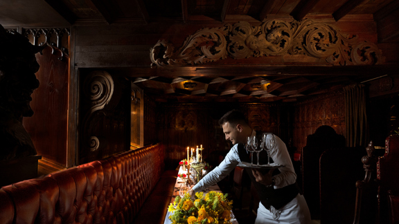 Waiter serving table in The Witchery Edinburgh
