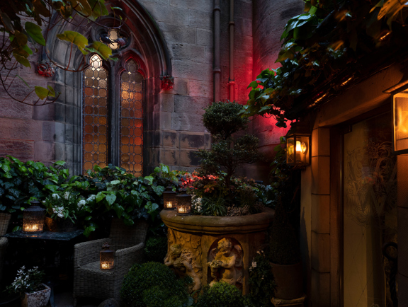 The Witchery Entrance with various plants and flowers around the entrance