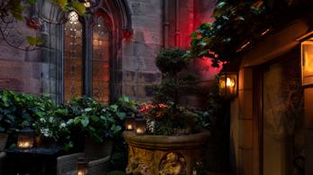 The Witchery Entrance with various plants and flowers around the entrance