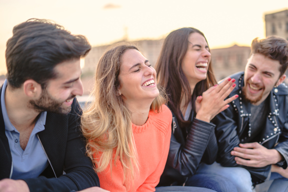 Group Of People Laughing On A Walking Tour