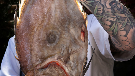 Chef at The Witchery holding fresh fish