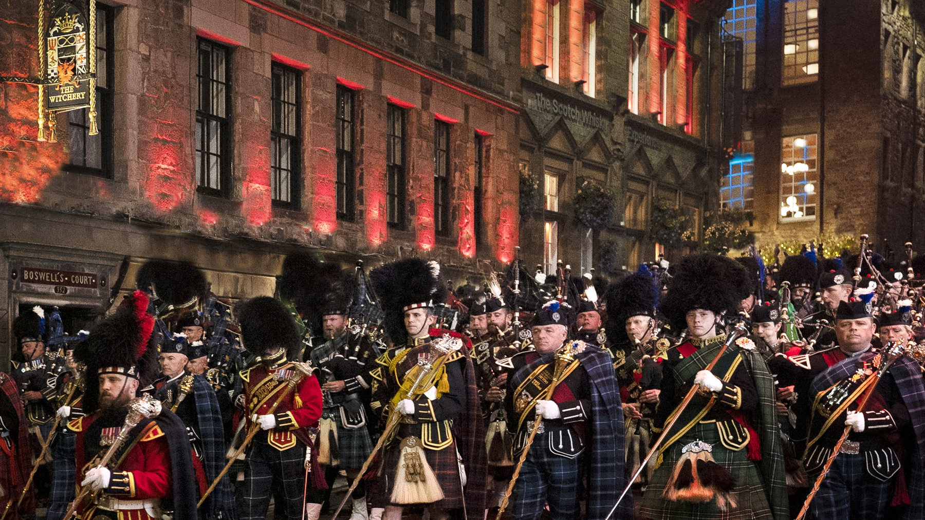 Pipe bands marching past The Witchery for the Edinburgh Tattoo