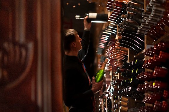 Handpicking wine in The Witchery's famous wine cellar