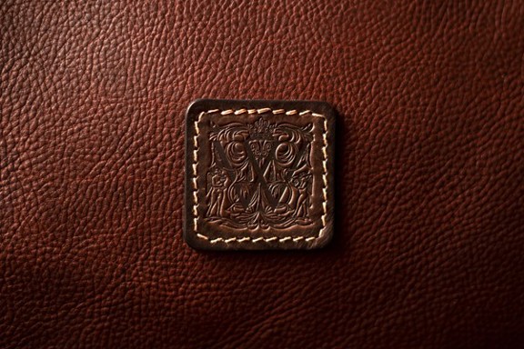 The Witchery logo on leather luggage sold in The Witchery Shop