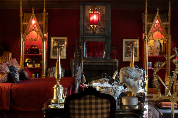 The Old Rectory Suite with rich textiles and antique elegance.